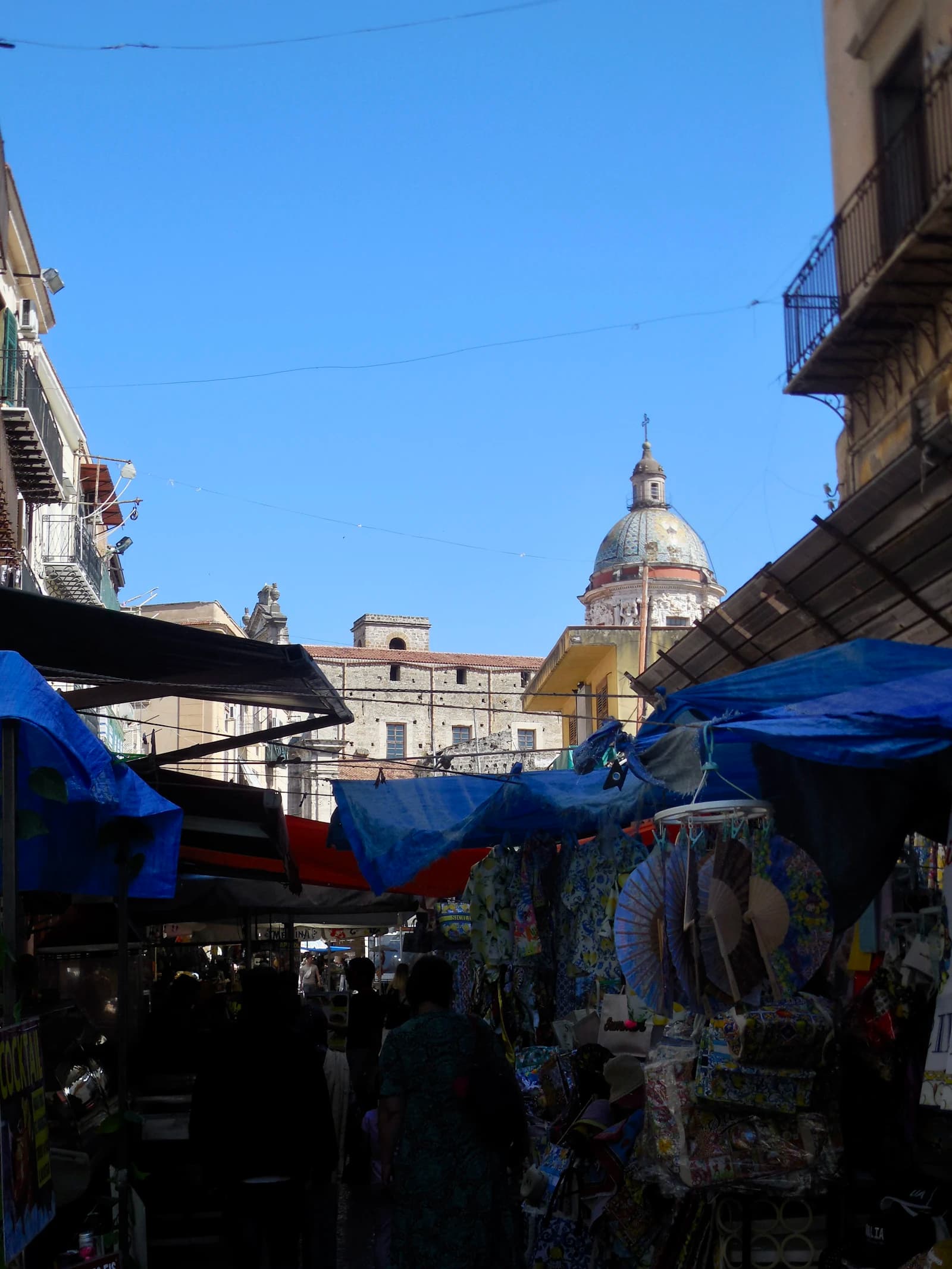 Market stalls beneath the Carmine Maggiore dome at Ballarò in Palermo